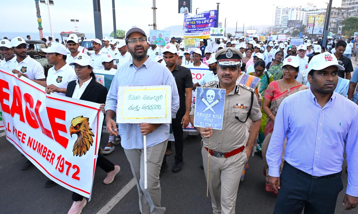 Visakhapatnam MP M. Sribharat, District Collector M. Abhishikth Kishore, Police Commissioner Shankhabrata Bagchi along with students participate in an awareness walkathon from Kali Temple to YMCA on Beach Road in Visakhapatnam on Thursday.
